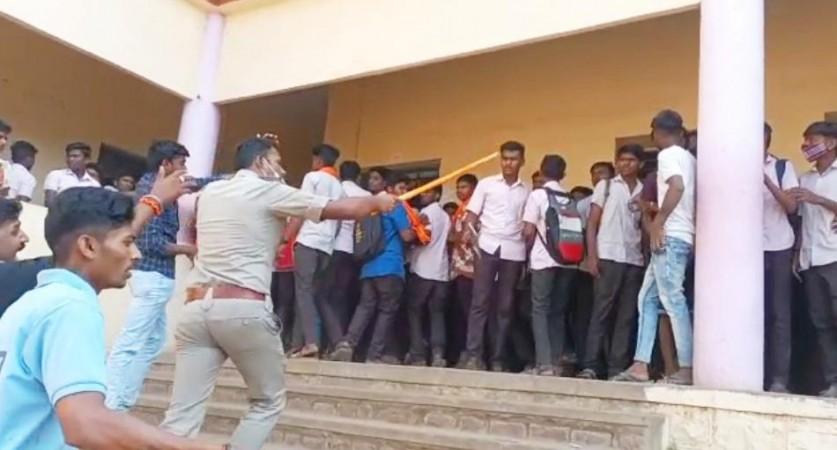Hijab row turns violent in K'taka; stone pelting, lathi-charge incidents reported Hijab row turns violent in K'taka; stone pelting, lathi-charge incidents reported