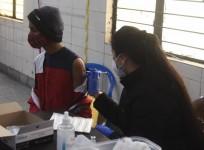A health worker administers a dose of Covid-19 vaccine to a beneficiary at Laxmi Nagar in New Delhi on Sunday, January 16, 2022. (Photo: Qamar Sibtain/IANS)