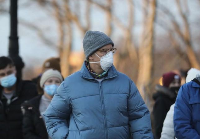 A man wearing a face mask walks on a street in Manhattan of New York. (Xinhua/Wang Ying/IANS) A man wearing a face mask walks on a street in Manhattan of New York. (Xinhua/Wang Ying/IANS)