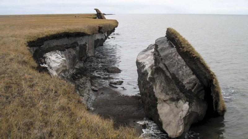 Thawing permafrost can result in the loss of terrain, as seen in this image where part of the coastal bluff along Drew Point, Alaska, has collapsed into the ocean. Credit: Benjamin Jones, USGS