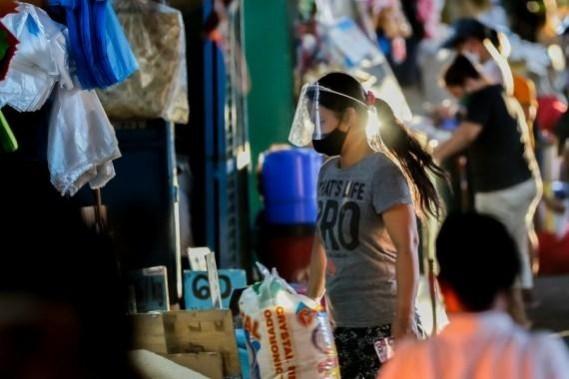 A woman wearing a face mask is seen at a market in Manila, the Philippines(File Photo) A woman wearing a face mask is seen at a market in Manila, the Philippines
