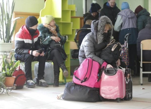 People rest at a temporary settlement site near Mariupol, Ukraine, March 17, 2022. People rest at a temporary settlement site near Mariupol, Ukraine, March 17, 2022.