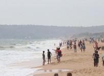 People seen enjoying themselves at Candolim Beach in Goa