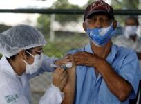 A man receives a dose of COVID-19 vaccine at Paulista Avenue in Sao Paulo, Brazil