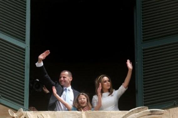 Malta's Prime Minister Robert Abela (L) waves to supporters in Valletta, Malta, March 28, 2022 Malta's Prime Minister Robert Abela (L) waves to supporters in Valletta, Malta, March 28, 2022