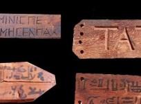 An image shows wooden death certificates unearthed at ancient tombs in southern Egyptian province of Sohag.