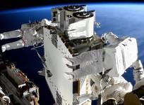 Spacewalkers Shane Kimbrough (foreground) and Thomas Pesquet work to prepare the second roll out solar array ready for installation an upcoming spacewalk.(*Credit: NASA)*