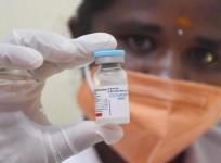 A health worker shows a vial of Covaxin dose of Covid-19 vaccine t