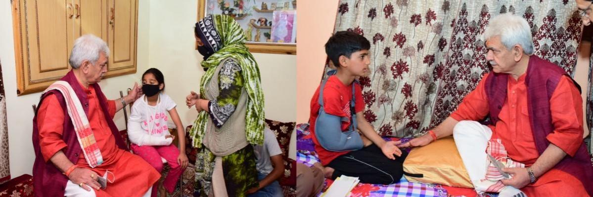 Lieutenant Governor Manoj Sinha meets two minor victims of gruesome terror attacks. LG consoling Safa Qadri, daughter of constable Saifullah Qadri (left). LG inquiring about the condition of Farhan, nephew of Ambreen Bhat (right) Minor victims of terrorism