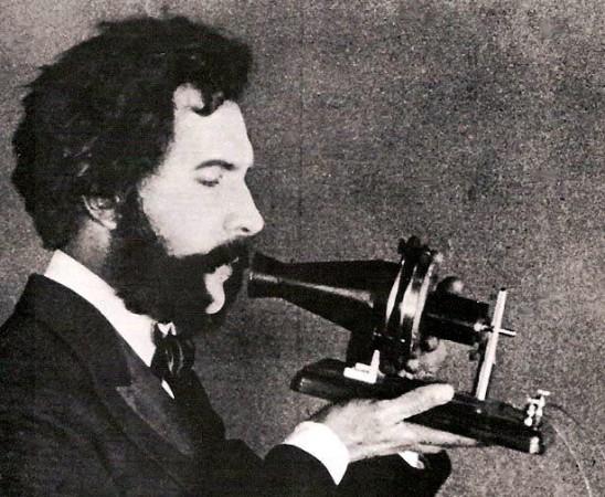 Actor portraying Alexander Graham Bell in a 1926 silent film. Shows Bell's first telephone transmitter (microphone), invented 1876 and first displayed at the Centennial Exposition, Philadelphia. Actor portraying Alexander Graham Bell in a 1926 silent film. Shows Bell's first telephone transmitter (microphone), invented 1876 and first displayed at the Centennial Exposition, Philadelphia.