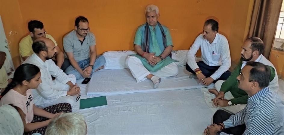 LG Manoj Sinha with family members of Rajni Bala