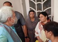 LG Manoj Sinha with family members of Rajni Bala