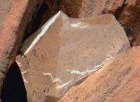 NASA Mars rover spots shiny foil piece between rocks