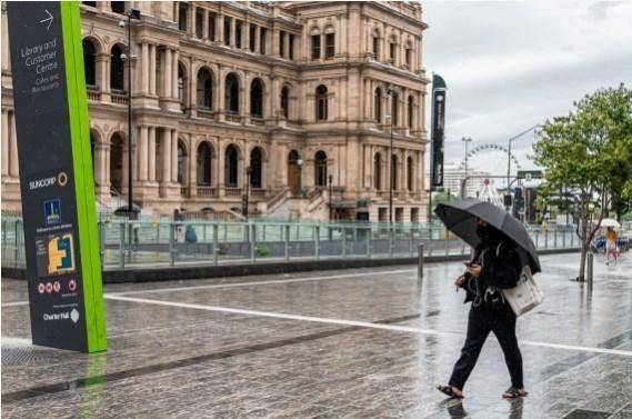 People wearing masks walk in Brisbane, Australia (File photo) People wearing masks walk in Brisbane, Australia,