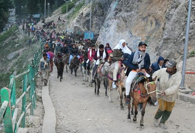 Pahalgam:Hindu devotees leave for the Amarnath Yatra annual pilgrimage to an icy Himalayan cave, in Nuwun, Pahalgam, on Thursday,June 30,2022 Amarnath Yatra