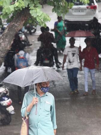 Bengaluru: A man holds an umbrella while walking past during rain in Bengaluru on Thursday, July 07, 2022. K'taka rains