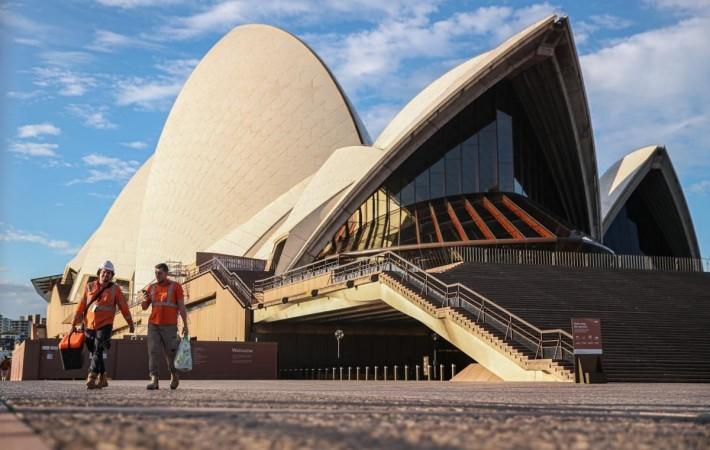 Photo taken on May 27, 2020 shows workers at Sydney Opera House in Sydney, Australia.