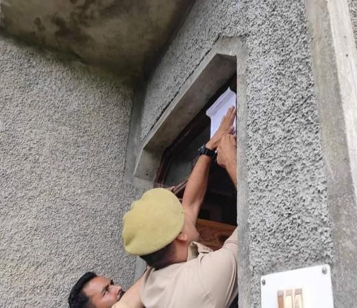 Cops seizing a house