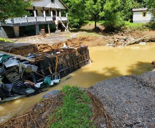 An overturned truck is seen after heavy rain-caused flooding in Central Appalachia in Kentucky, the United States, July 30, 2022. floods, heavy rains in Kentucky