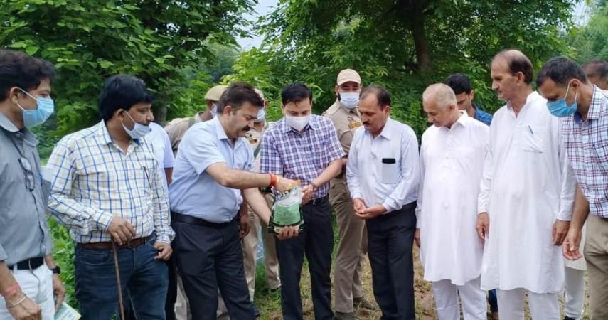 Deputy Commissioner Kathua Rahul Pandey distributing seeds of castor crops to the farmers of the areas worst affected by monkey menace Deputy Commissioner Kathua
