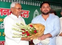 JDU party leader Nitish Kumar being welcomed by RJD leader Tejashwi Yadav