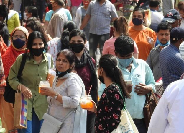 People not wearing masks at Lajpat Nagar market. According to new guidelines by Delhi Government, masks are mandatory after the rise in Covid cases, in New Delhi Covid cases on rise