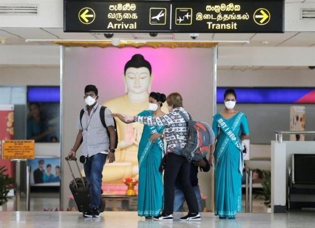 Bandaranaike international airport officials wears masks as they direct tourists after they went through a temperature scanner at Bandaranaike international airport in Katunayake, Sri Lanka, Jan. 24, 2020(File Photo) Bandaranaike international airport officials