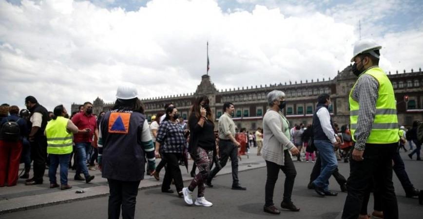 People gather in the Zocalo Square after an earthquake in Mexico City, Mexico, on Sept. 19, 2022. earthquake in Mexico City,