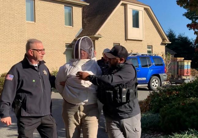 Officers apprehending Woods Bees