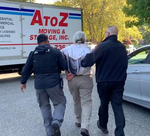 Woods being arrested and taken to the cruiser Bees