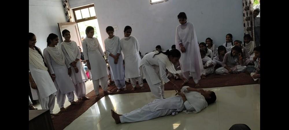 During the Back-to-Village programme students of the government higher secondary school of the border village of Treva presenting a street play against drug addiction Back to village