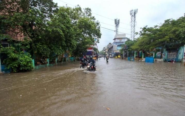 Chennai:Commuters wade through flooded road during heavy rains in Chennai on Tuesday November 01,2022 Chennai:Commuters wade through flooded road during heavy rains in Chennai on Tuesday November 01,2022