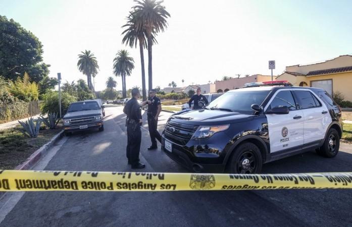 LOS ANGELES, Oct. 16, 2016 (Xinhua) -- Los Angeles police officers stand guard behind the yellow tape at the scene of a fatal shooting in Los Angeles, the United States, Oct. 15, 2016. Three people were killed and 12 others wounded when a mass shooting broke out in Los Angeles on Saturday, police said (File Photo) LOS ANGELES, Oct. 16, 2016 (Xinhua) -- Los Angeles police officers stand guard behind the yellow tape at the scene of a fatal shooting in Los Angeles, the United States, Oct. 15, 2016. Three people were killed and 12 others wounded when a mass shooting br