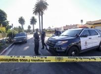 LOS ANGELES, Oct. 16, 2016 (Xinhua) -- Los Angeles police officers stand guard behind the yellow tape at the scene of a fatal shooting in Los Angeles, the United States, Oct. 15, 2016. Three people were killed and 12 others wounded when a mass shooting br