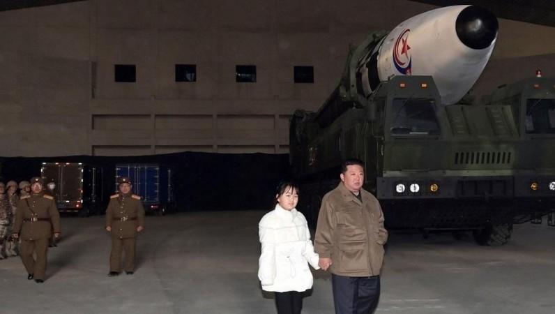 Seoul :North Korean leader Kim Jong-un (R), alongside his daughter wearing a winter jacket, views a new type of the Hwasong-17 intercontinental ballistic missile (ICBM) during an on-site inspection of the missile launch at Pyongyang International Airport on Nov. 18, 2022, in this photo released by the North's official Korean Central News Agency North Korean leader Kim Jong-un (R), alongside his daughter wearing a winter jacket