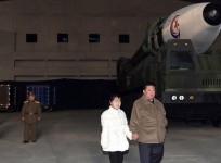 North Korean leader Kim Jong-un (R), alongside his daughter wearing a winter jacket