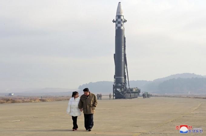 Seoul :North Korean leader Kim Jong-un (R), alongside his daughter wearing a winter jacket, views a new type of the Hwasong-17 intercontinental ballistic missile (ICBM) during an on-site inspection of the missile launch at Pyongyang International Airport on Nov. 18, 2022 North Korean leader Kim Jong-un (R), alongside his daughter wearing a winter jacket.