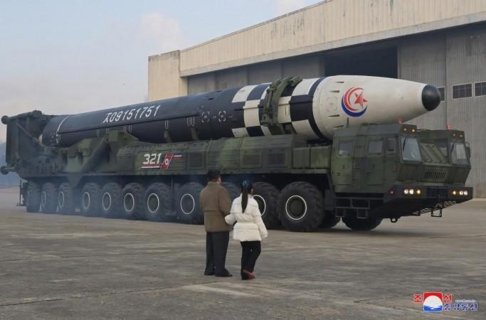 Seoul :North Korean leader Kim Jong-un (R), alongside his daughter wearing a winter jacket, views a new type of the Hwasong-17 intercontinental ballistic missile (ICBM) during an on-site inspection of the missile launch at Pyongyang International Airport on Nov. 18, 2022 North Korean leader Kim Jong-un (R), alongside his daughter wearing a winter jacket.