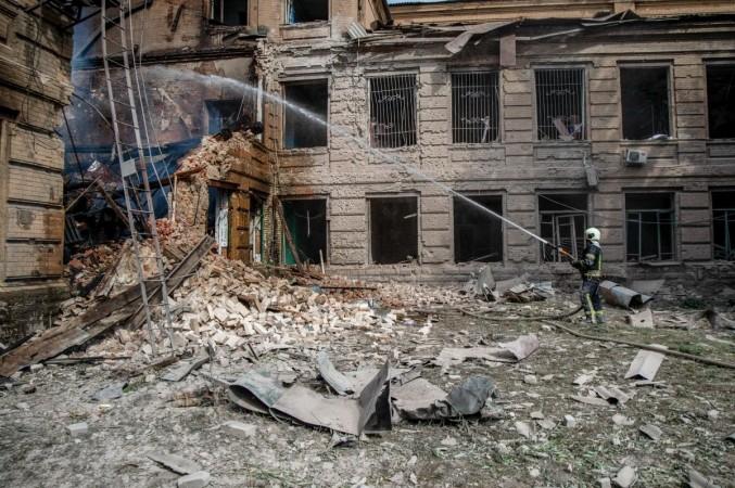 26 August 2022, Ukraine, Slovyansk: A rescue worker extinguishes a fire caused by an overnight shelling at the Slovyansk Chemical Mechanical College. 26 August 2022, Ukraine, Slovyansk: A rescue worker extinguishes a fire caused by an overnight shelling at the Slovyansk Chemical Mechanical College