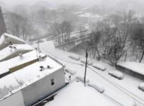 A man walks on a snow-covered road in New York, the United States, on Feb. 1, 2021.