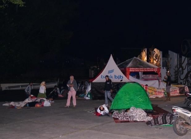 People affected by the earthquake rest outdoors in Cianjur, West Java, Indonesia, on Nov. 22, 2022 People affected by the earthquake rest outdoors in Cianjur, West Java, Indonesia, on Nov. 22, 2022