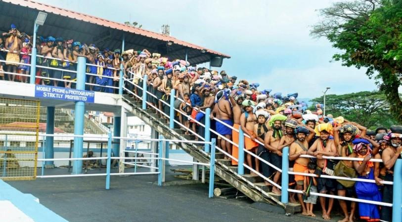 Pathanamthitta: Devotees in large numbers stand in queues to offer prayers at Sabarimala temple which opened for two-month-long Mandala-makaravilakku pilgrimages, in Pathanamthitta district in Kerala on 17 November, 2022 Devotees in large numbers stand in queues to offer prayers at Sabarimala temple