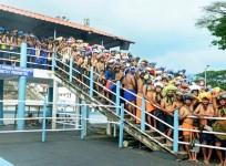 Devotees in large numbers stand in queues to offer prayers at Sabarimala temple