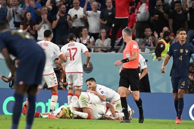 Players of Tunisia celebrate after Wahbi Khazri scored their side's opening goal against France during a World Cup group D soccer match at the Education City Stadium in Al Rayyan, Qatar, Wednesday, Nov. 30, 2022 Players of Tunisia celebrate after Wahbi Khazri scored their side's opening goal against France during a World Cup