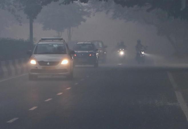 New Delhi : Vehicles ply on fumigated road, in New Delhi on Saturday, October 22, 2022. Delhi pollution