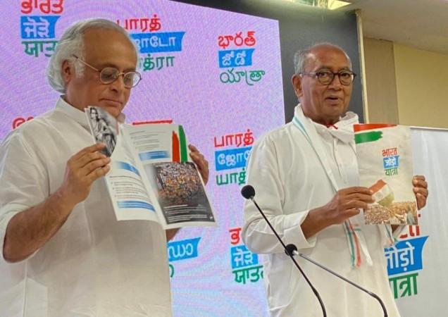 Congress party leaders Digvijay Singh and Jairam Ramesh releasing a Bharat Jodo Yatra brochure BJY brochure