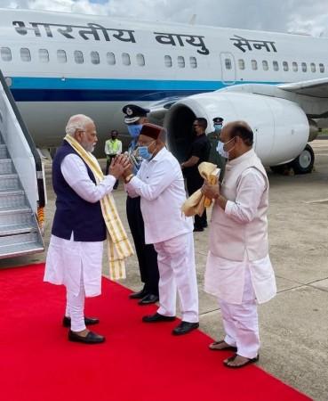 Bengaluru: Prime Minister Narendra Modi being welcomed by Karnataka CM Basavaraj Bommai, Governor Thawar Chand Gehlot at Yelahanka Air Base in Bengaluru on Monday, June 20, 2022. Bengaluru: Prime Minister Narendra Modi being welcomed by Karnataka CM Basavaraj Bommai, Governor Thawar Chand Gehlot at Yelahanka Air Base in Bengaluru on Monday, June 20, 2022.