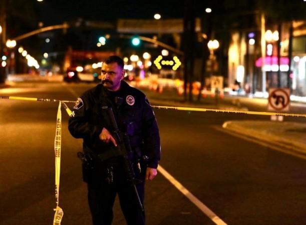 A police officer stands guard on the scene of a mass shooting in Monterey Park, California, the United States, Jan. 22, 2023 shooting