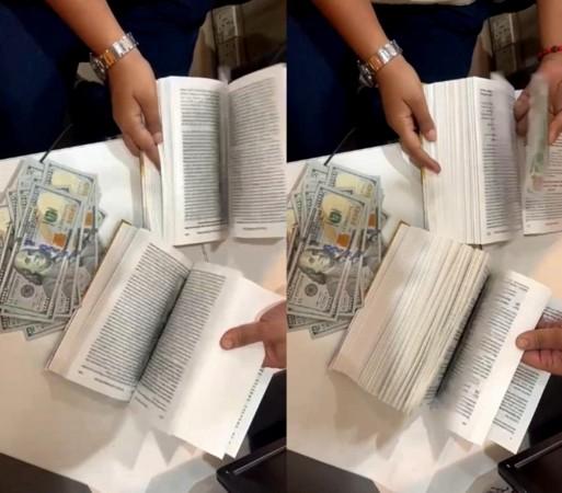 Man hiding 90,000 US Dollar between book pages, held at Mumbai Airport. Man hiding 90,000 US Dollar between book pages, held at Mumbai Airport.