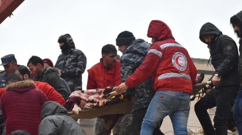 People transfer a victim of a powerful earthquake in the al-Arbaeen neighborhood in Hama province, Syria, on Feb. 6, 2023. According to the Syrian health ministry and the Britain-based pro-rebel Syrian Observatory for Human Rights, a 7.7-magnitude earthquake jolted the northern Syrian provinces of Latakia, Tartous, Hama, Aleppo, and Idlib on Monday, killing at least 870 and injuring 1,326 Powerful earthquake in the al-Arbaeen neighborhood in Hama province, Syria